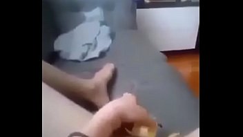 Naked Kazakh woman masturbates her vagina with a banana on the couch